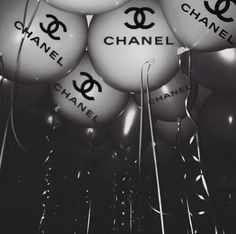 black and white photograph of chanel balloons