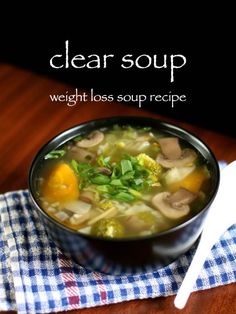 a close up of a bowl of soup on a table