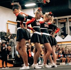 the cheerleaders are performing their routine for the crowd