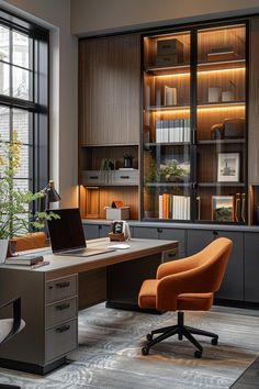 an office with a desk, chair and bookcase