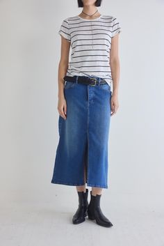 The 90's Denim Midi Skirt is a nostalgic revival of the iconic denim trends from the past, infused with a modern twist for a fresh and stylish edge. This skirt is crafted for those who appreciate the timeless charm of the '90s, making it a must-have piece for the fashion-forward individual. Midi length Split center hem Denim fabric Pockets Retro High Rise Denim Skirt For Spring, Classic High Rise Denim Skirt For Summer, Classic Mid-rise Denim Skirt For Summer, Classic High Waist Denim Skirt For Spring, Classic Mid-rise Denim Skirt For Spring, Classic Blue Denim Summer Skirt, Classic Blue Denim Skirt For Summer, Classic High-waist Denim Skirt For Spring, Classic Straight Leg Denim Skirt For Spring