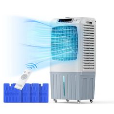 an air conditioner sitting on top of a white surface next to blue plastic blocks