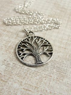 want Silver Tree Of Life Round Pendant Necklace, Symbolic Silver Necklace With Tree Of Life, Symbolic Hypoallergenic Silver Necklace, Silver Tree Of Life Necklace For Jewelry Making, Symbolic Silver Cadmium-free Charm Necklace, Cadmium-free Silver Round Charm Necklace, Antique Silver Necklace Gift, Antique Silver Necklace With Silver Chain As A Gift, Rowan Tree