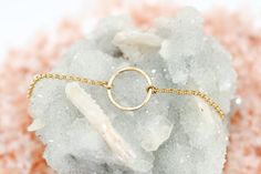 Gold circle bracelet - This dainty gold bracelet features a beautifully hammered 14k gold filled circle, centered on substantial 14k gold filled rolo chain. A timeless, minimalist bracelet. Arrives gift boxed Sea and Cake packaging. *Handmade with love in the USA! *Bracelet closes with a 14k gold filled lobster clasp. *Also available in sterling silver and 14k rose gold filled. *All components are 14k gold filled which will last a lifetime, unlike gold plated. For more Sea and Cake: Pinterest - Minimalist 14k Gold Filled Round Bracelets, Minimalist 14k Gold Filled Round Bracelet, Minimalist Gold Crystal Round Bracelet, Delicate Yellow Gold Round Bracelet, Minimalist Round Bracelet With Adjustable Length, Minimalist 14k Gold-filled Delicate Chain Bracelet, Minimalist 14k Gold-filled Round Bracelets, Delicate Gold Jewelry, Karma Bracelet