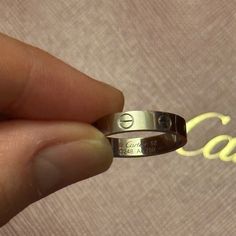 Authentic Cartier Wedding Band Love Ring In White Gold Size 52. Purchased Online Aug 25, 2022. Certificate, Box, And Bag Will Be Included. Receipt Will Not Be Included As It Has My Personal Information Along With Other Items I Had Purchased. There Are Normal Wear And Tear As Pictured However, It Could Be Easily Cleaned And Buffed Out At The Cartier Store For Free. I Have Not Gotten It Serviced Yet. I Am Selling Because I Don’t Use This As Much Since The Sizing Ended Up Being Too Small And I Felt Like The White Gold Doesn’t Suit Me. So, I’m Trying To Sell My White Gold Jewelry. I Cannot Lower My Price By Much As At Its Current Price I’m Already At A Significant Loss. Engraved Cartier White Gold Jewelry, Cartier White Gold Rings For Anniversary, Cartier Luxury Promise Ring, Luxury Cartier Promise Ring, Cartier Wedding Rings With Vs Clarity, Luxury Silver Diamond Couple Rings, Cartier Silver Diamond Cut Jewelry, Silver Cartier Jewelry With Diamond Cut, Silver Cartier Ring With Polished Finish