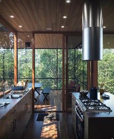 an image of a modern kitchen setting with wood flooring and ceiling lighting in the background