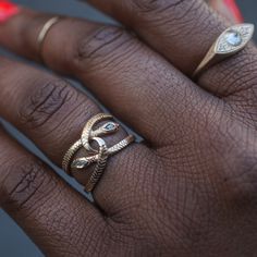 Like its larger sterling silver cousin, a snake wrapped & poised around an Asclepian Rod, a snake that makes its way around a measure of health just like mercury, a symbol of strength, resilience, and perseverance. Handmade in our San Francisco Studios & available in14k yellow or rose gold with ruby eyes and either no diamond, a white marquise diamond, a black marquise diamond, or a salt & pepper marquise diamond set in its head. Silver Snake-shaped Fine Jewelry Ring, Luxury Silver Snake-shaped Ring, Unique Gold Snake-shaped Rings, Luxury Gold Snake-shaped Ring, Snake Ring Antique, Symbols Of Strength, Snake Ring, Gold Snake, Marquise Diamond