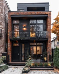 an apartment building with black doors and windows