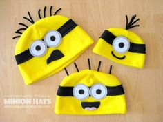 three hats made to look like minion faces