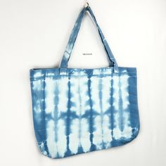 new + preloved.   apparel + sundries.    everyday + life. Tie-Dye Tote Bag Tie-Dye Tote Bag Tie-dye canvas tote with convenient open-top construction, cut from a soft lightweight unlined canvas fabric and topped with dual carry handles. Perfect for beach days, market trips or as a simple carryall handbag. Folds easily, making it simple to stow away when not in use.  While the pattern and color scheme of each bag is as pictured and described, there may be slight variation from one tote to the nex Carry All Bag, Shopper Tote, Beach Days, Open Top, Beach Day, Color Scheme, Canvas Tote, Everyday Life, Canvas Fabric