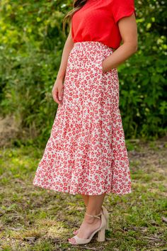 We cannot get over how stylish this skirt is! The beautiful floral print and tiered style fit makes such a cute, elegant look! Wear this skirt to any event and you are sure to receive compliments! We love tucking a blouse into this for a more elevated look or a basic or graphic tee for a casual feel! Self: 100% PolyesterLining: 100% Rayon Hand wash cold. Do not bleach. Lay flat to dry. Low iron if necessary. Kimono Blouse, Tiered Midi Skirt, Romper And Jacket, Guest Attire, Wedding Attire Guest, Red S, Long Sleeve Short Dress, Loungewear Sets, Low Iron