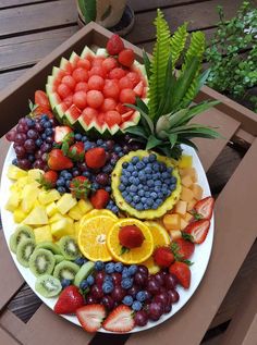 a white plate topped with lots of fruit