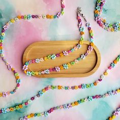 Add a splash of color to your outfit with this handmade rainbow beaded flower necklace! Perfect for teens, preppy styles, or as a unique friendship gift, this necklace features intricate seed bead flowers in vibrant pastel hues. Great for spring, summer, festivals, or daily wear, this accessory is lightweight, adjustable, and versatile. Gift this to your best friend, sister, or yourself! Each necklace is crafted with care, ensuring durability and charm. Pair it with our other cute accessories, l Cute Flower Beaded Necklaces With Colorful Beads, Multicolor Flower-shaped Beaded Necklaces With Tiny Beads, Flower Shaped Beaded Necklaces For Jewelry Making, Cute Flower-shaped Colorful Beaded Necklaces, Multicolor Flower Shaped Beaded Necklace With Tiny Beads, Multicolor Flower-shaped Beaded Necklace With Tiny Beads, Multicolor Flower-shaped Beaded Necklaces, Preppy Rainbow, Jewelry Preppy