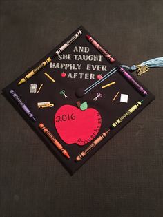 a graduation cap with writing on it that says and she taught happily ever after 2016