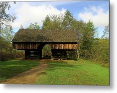 an old wooden covered bridge in the woods