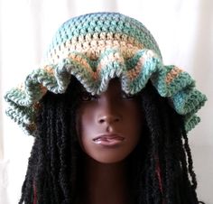 Make a statement at your next party or casual event with this stylish and unique Crochet Ruffle Bucket Hat. The sea green and blue striped pattern is sure to catch eyes and the acrylic material with crochet fabric makes it stretchy and breathable for comfort. Handmade with love, this hat features a trendy ruffle accent and is one size fits most adults. It's perfect for anyone who wants to add a colorful and fashionable touch to their outfits. Don't miss out on this must-have accessory for any wardrobe. Return to my main shop page here: https://www.etsy.com/shop/DreamsbytheStitch When Does it Ship? Hat ships within 3-5 days. How does it Ship? Your item will be shipped by USPS First Class Mail in the US. Orders that total more than $35 will ship for free within the US. Items for Internationa Adjustable Ruffled Hat With Curved Brim, Spring Fitted Hats With Ruffles, Fitted Spring Hat With Ruffles, Fitted Ruffle Hats For Spring, Fitted Ruffled Hats For Spring, Adjustable Beanie With Ruffles, Spring Hats With Ruffles One Size, Summer Bucket Hat With Ruffles, Summer Ruffled Bucket Hat