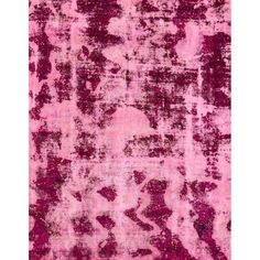 a pink area rug with an abstract design