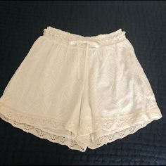 Beautiful White Eyelet Shorts With Satin Dash/Tie Detail Elastic Waist Fully Lined Nwot Casual Bottoms With Lace Trim, Summer Daywear Shorts With Lace Trim, Summer Lace Trim Shorts For Daywear, Summer Lace Trim Shorts For Day Out, Lace Trim Shorts For Summer Day Out, Summer Shorts With Lace Trim For Day Out, Summer Bottoms With Lace Trim And Short Shape, Summer Bottoms With Lace Trim, White Bohemian Shorts For Loungewear