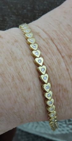 Ladies 14kt yellow gold diamond heart bracelet. 42- round cut diamonds 1.28 cts. Color- G                    Clarity-SI1. 5 mm Wide. 7 inches long. Heart Bracelet, Diamond Heart, Round Cut Diamond, Chain Link Bracelet, Link Bracelets, Chain Link, Round Cut, Gold Diamond, Jewelry Bracelets