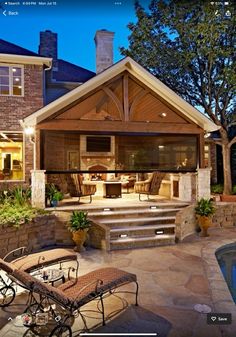 an outdoor living area next to a swimming pool