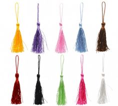 six different colors of tassels on a white background