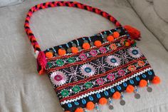 This Beautiful Afghani shoulder bag goes with western as well as traditional dresses. It is embellished with coins, sea shells and beads. Traditional Embellished Multicolor Shoulder Bag, Traditional Multicolor Embellished Shoulder Bag, Bohemian Beaded Shoulder Bag, Bohemian Multicolor Embellished Shoulder Bag, Bohemian Beaded Shoulder Bag For Summer, Bohemian Embellished Travel Bags, Summer Bohemian Beaded Shoulder Bag, Beaded Bohemian Shoulder Bag For Festival, Bohemian Embellished Bag For Festivals