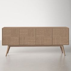 the sideboard is made out of wood and has an unusual pattern on it's sides