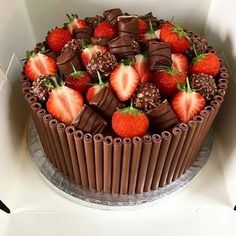 there is a chocolate cake with strawberries on top