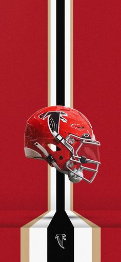 a football helmet on top of a black and white striped background