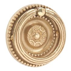 an antique brass knob with beading on the top and bottom, is shown against a white background