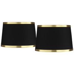 two black lamps with gold trims on the sides and one has a dark shade