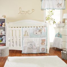 a baby crib bedding set with teddy bears