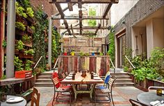 an outdoor dining area with tables and chairs