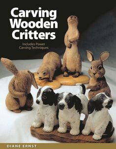 the cover of carving wooden critters shows four dogs and three rabbits sitting on top of each other