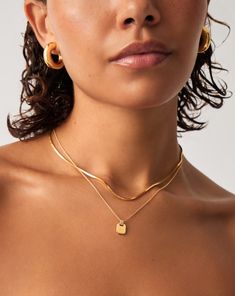 Engravable Small Tag Pendant Necklace | 18k Gold Vermeil. Make It Personal with this Handcrafted Engravable Necklace. Paired with a Delicate Chain, the Small Smooth Rectangular Tag Pendant Can be Engraved on Both Sides. Add a Date, Meaningful Message or Personalized Motif to Create a One-Of-A-Kind Jewelry Gift. Please Note: Engraving Items May Take 2 Working Days to Process. Metal: 18K Recycled Gold Plated Vermeil on Recycled Sterling Silver Pendant Dimensions: 8. 3mm Chain Length: 450mm Weight: 3. 3g Product Code: Eng-G-N1-Ns Engravable Necklace, Double Chain Bracelet, Unique Jewelry Gifts, Delicate Chain, Demi Fine Jewelry, Engraved Necklace, Gold Price, Elegant Necklaces, Coin Necklace