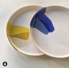 two plates with yellow and blue shapes on them