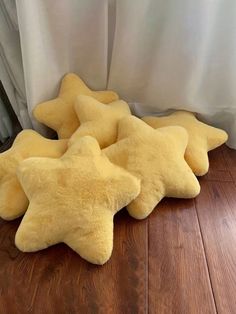 four yellow stars are laying on the floor