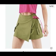 Nwt- $69.95 Fabletics Jillian Wrap Skirt Olive Green/ Pink Trim Size Xl 12/14 51”- From Side To Side Laying Flat- Unwrapped 18”- Across Back Of Waist Laying Flat 16”- Length Down Back Laying Flat 92% Polyester 8% Elastane Spring High Waist Athleisure Skort, High Waist Athleisure Skort For Spring, Green Athleisure Skirt For Spring, High Waist Casual Sports Skirt, Athleisure Green Spring Skirt, Casual High Waist Sports Skirt, Athleisure Green Skirt For Spring, Casual High-waist Sports Skirt, Summer Workout Skirt With Pockets