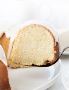 a slice of cake on a white plate with a fork in it and the rest of the cake being eaten