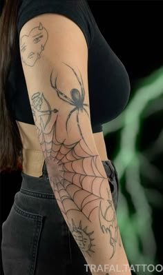 a woman with a spider web tattoo on her arm