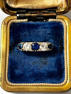 Gorgeous Victorian 18k Gold Engraved Sapphire & Diamond Ring with three oval cut natural sapphires and two old mine diamonds all set in an intricately carved gallery. The stones are beautiful and sparkling, a very fine quality and classic example of the Victorian era. It is hallmarked with the French eagle's head (for 18k gold purity).  US size: 6 3/4 (it can be resized upon request) Weight: 4.8 grams Excellent antique conditions. Thank you for visiting Boudoir Vintage!   Please feel free to contact me for further information or photos.  I offer international shipping. Your item will be packed with extreme care and will be shipped within 3-5 working days. If you are dissatisfied with your item, please feel free to contact me and would be happy to assist.  If you are interested in paying in Antique Oval Three Stone Diamond Ring, Victorian Sapphire Ring With Oval Brilliant Cut, Vintage Sapphire Three-stone Ring, Vintage Sapphire Three Stone Ring, Vintage Sapphire Three Stone Diamond Ring, Victorian Sapphire Ring With Diamond Oval Shape, Antique Three Stone 14k Gold Jewelry, Victorian Oval Sapphire Ring With Diamond, Antique Oval Sapphire Ring With Rose Cut Diamonds