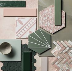 an assortment of different tiles and accessories on a pink surface with green accents, including a bowl