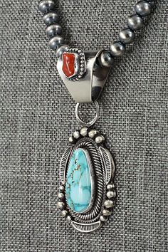 This stunning coral, natural Kingman turquoise and sterling silver necklace was made by Navajo silversmith Tom Lewis. The back is signed Tom Lewis and stamped sterling.Necklace: 19"Pendant Length: 2 1/2"Pendant Width: 1"Bead Size: 1/4" (6mm)Free shipping on all orders! We ship with USPS and always include tracking. All orders ship within a day of payment.Returns are accepted up to 30 days after you receive your order. Just send us a message. Our shop offers cash back or store credit. The item mu Turquoise Jewelry Outfit, Moda Hippie, Spiny Oyster Jewelry, Vintage Native American Jewelry, Western Accessories, Zuni Jewelry, Southwest Jewelry, Western Jewelry, Coral Turquoise