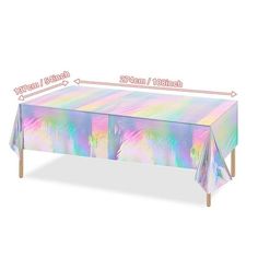 a table covered in holographic paper with measurements for the top and bottom half