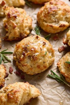 some biscuits with rosemary sprigs on top of them are ready to be eaten