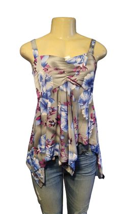 Take this top on vacation with you this year! It is a very cute baby doll blue top, material is soft to the touch and has a floral print to it in blue, purple, and white tones. It is true to size. Has lots of stretch! Would make a good pregnancy top. Material is 65% spandex and 35%polyester Purple Floral Print Top For Day Out, Summer Floral Print Purple Tops, Purple Floral Print Summer Top, Summer Purple Floral Print Top, Casual Purple Floral Print Tops, Purple Flowy Beach Top, Flowy Purple Beach Top, Casual Purple Tank Top With Floral Print, Floral Print Stretch Tops For Vacation