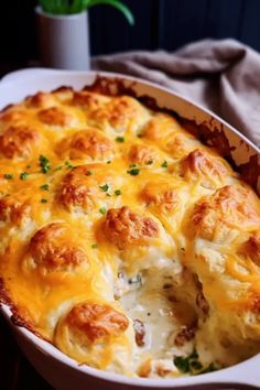 a casserole dish with cheese and meat in it