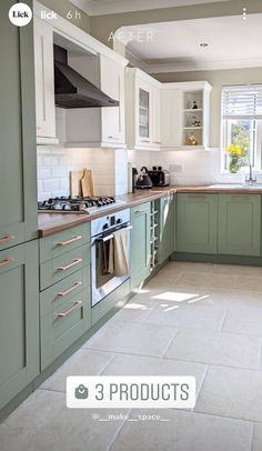 an image of a kitchen setting with green cabinets and white tile flooring on the walls