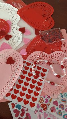 valentine's day cards are laid out on top of each other, including hearts