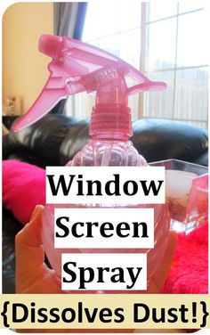 a bottle of window screen sprayer sitting on top of a pink blanket next to a black couch